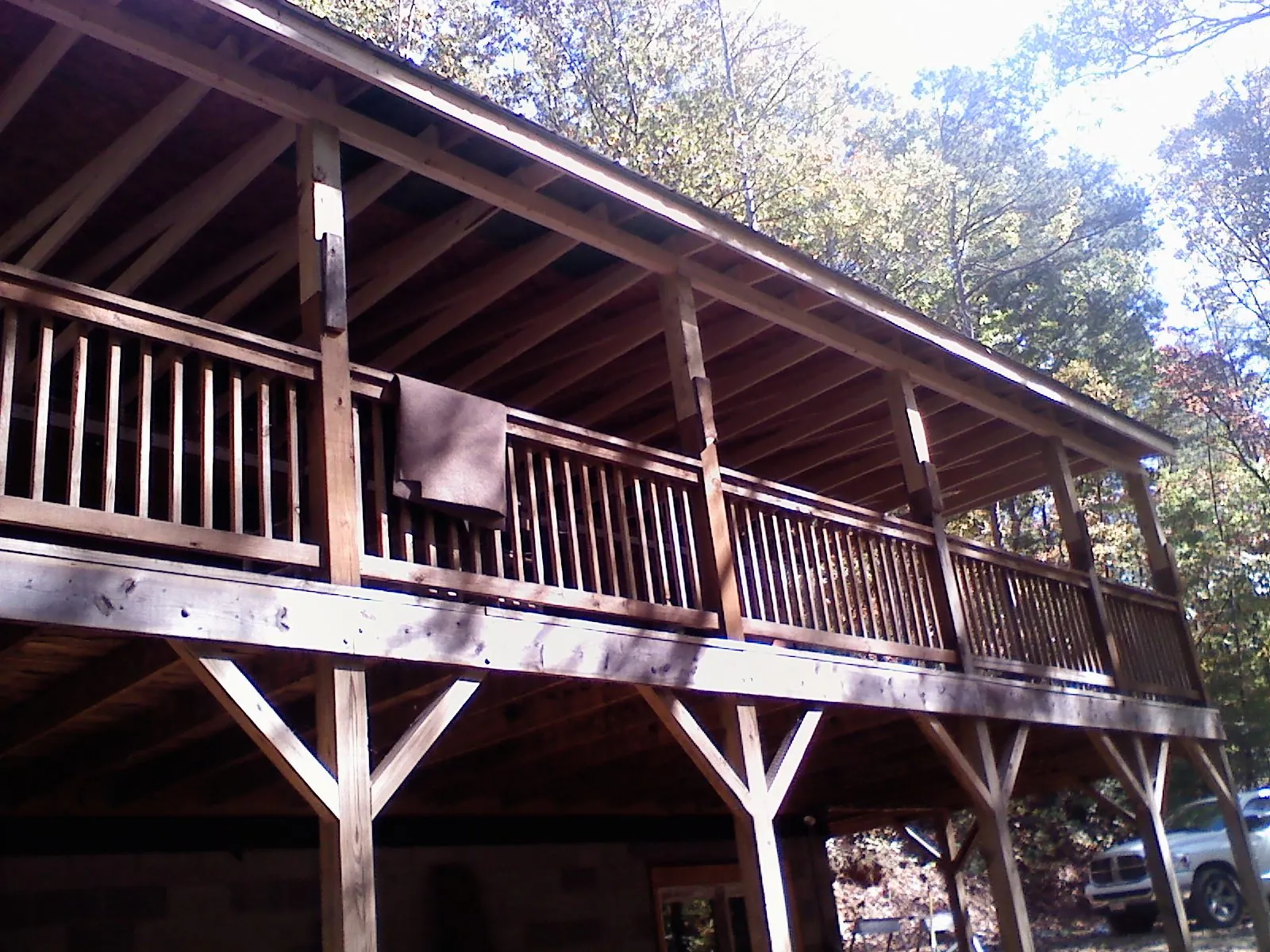 Timber framing under a new elevated porch and deck — Roof Leak Repair in Harbor Springs by Roofing Brothers